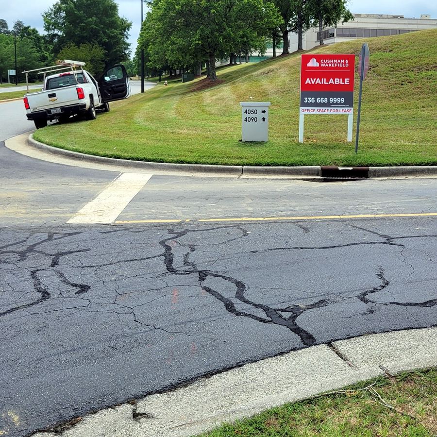 4x4 Property Sign for Cushman Wakefield Triad completed by Carolina Realty Signs